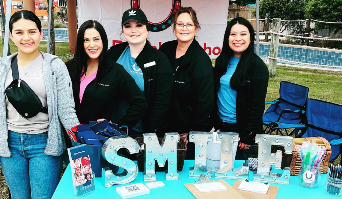 An Image of the Dr. Farrah Orthodontics Team at a Community Event
